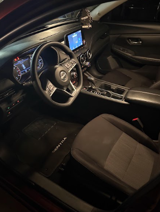 Nissan Sentra dashboard, steering wheel and seats photographed after interior detailing